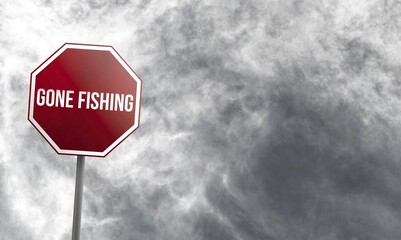 Gone fishing, red sign with clouds in background