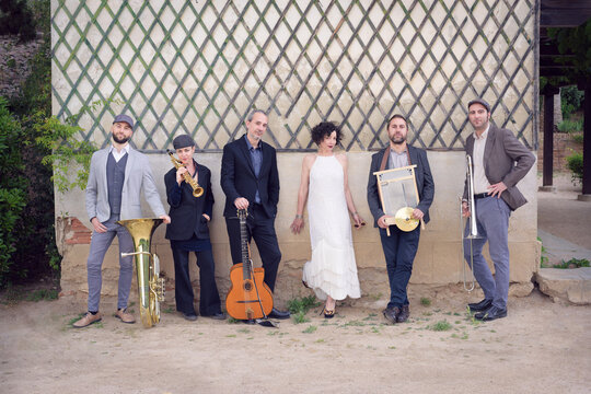 Jazz band of six people with different musical instruments, dres