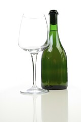 Bottle of white wine with a glass