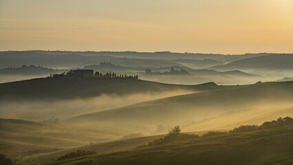 Hilly landscape with foggy atmosphere and country estate, morning light, Tuscany, Siena province, Italy, Europe
