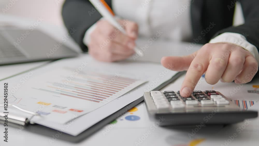Poster a highly skilled professional accountant diligently working to calculate important financial figures