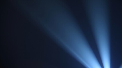 Abstract Blue Light Rays on Black Background