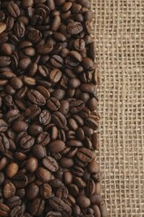 Fototapeta premium Coffee beans on a burlap sack