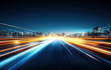 Fast highway traffic towards illuminated city at dusk