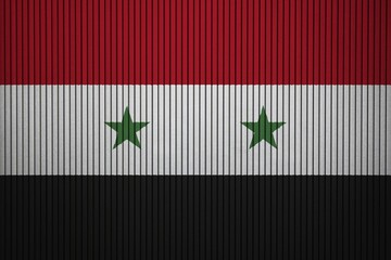 Syria Flag painted on the cracked grunge concrete wall