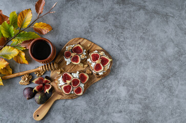 A plate of fruit with a wooden board and a cup of coffee. Scene is relaxed and casual