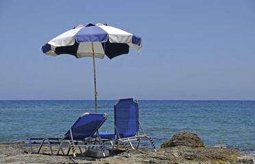Two sun loungers and a parasol at the beach, Stalida, Stalis, Crete, Greece, Europe