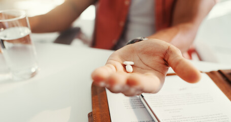 Business person, hands and pills for anxiety, treatment or medical drugs for pain relief in office. Healthcare, prescription and man with medicine, supplements or vitamins for pharmaceutical help