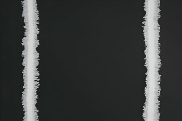 Two Vertical White Fringed Ribbons on a Dark Background Create a Simple Yet Striking Visual Contrast