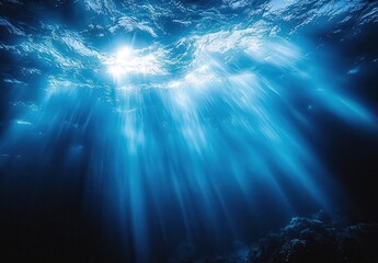 Ethereal Sunlight Streaming Through Deep Ocean Waters Creating Magical Blue Light Rays in Underwater Environment