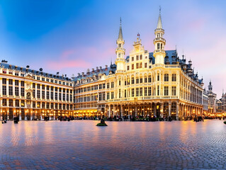 Fototapeta premium Grand Place Square Illuminates with Majestic Architecture at Dusk in the Heart of the City