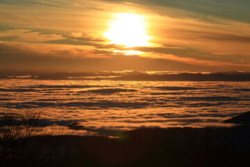 Foggy landscape from above, winter weather inversion, sunset sky