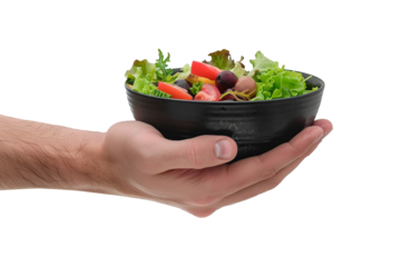 Hand holding a bowl of fresh salad over a neutral background showcasing healthy eating