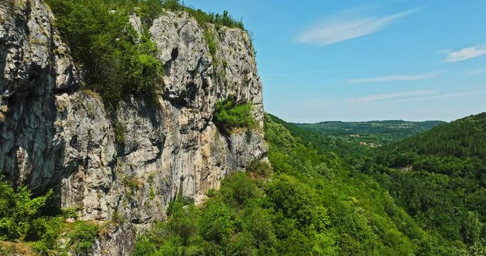 Natural Stone Cliff Wall Beautiful Landscape Scene In Rural Bulgaria Aerial Rise Tilt Down