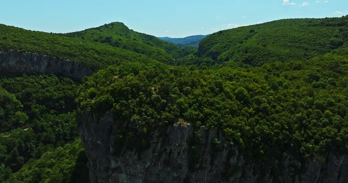 Ancient River Bed Carved Mountain Meandre Covered In Green Forest Balkans Aerial Fly Over