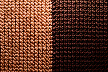 Fototapeta premium Close-Up of Knitted Fabric Shows Intricate Stitches and Texture with Two-Tone Colors, Creating Visually Appealing Design.