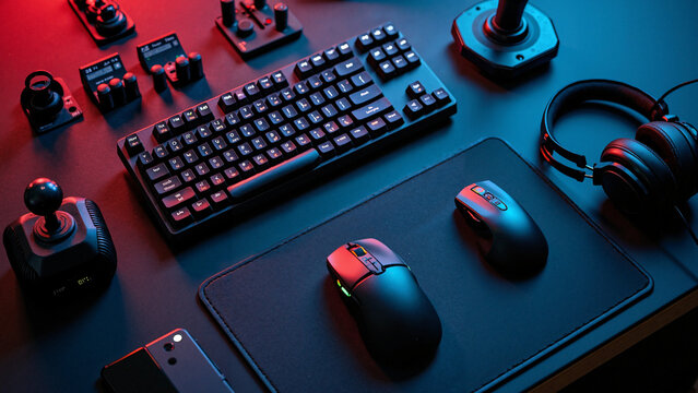 High-resolution top-view of a modern gamer workspace with essential gaming gear, ideal for tech blogs, esports promotions, and gaming product ads.