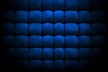 Fototapeta premium Dark Blue Upholstered Wall Creates a Luxurious and Dramatic Background Texture Design.