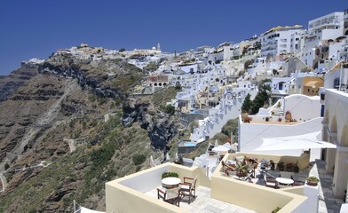 View over the town of Thira, Fira, on a crater's edge with typical Cycladic architecture,...
