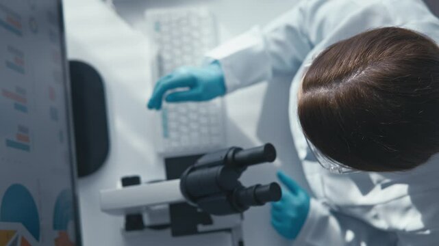 A dedicated scientist is meticulously analyzing various samples under a highpowered microscope in a wellequipped laboratory environment, contributing to significant research in the field of science