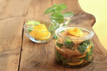 Homemade syrup made from fresh leaves of Plectranthus (Coleus) amboinicus, lemon slices and brown sugar. Traditional herb also known as Cuban oregano, syrup good for colds.