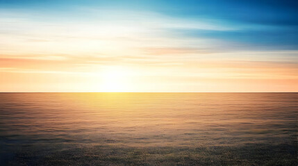 Fototapeta premium Sunset Over a Vast Expanse Creates a Warm, Golden Glow on the Horizon