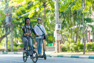 Obraz premium Young Commuters with Eco-Friendly Transportation