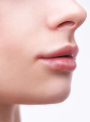 Obraz premium Woman showing herpes disease on her lips. Treatment of viral infections.