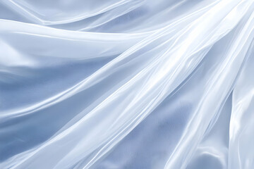 Obraz premium Smooth Elegant Light Blue Silk or Satin Fabric Texture Background with Waves and Folds