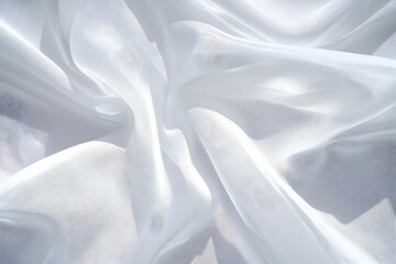 Obraz premium White Sheer Fabric Drapes and Flows Gracefully, Creating an Elegant Texture Background for Designs