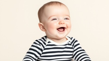 Happy Baby in Striped Onesie Against Beige Background