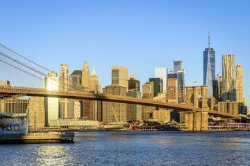 Brooklyn Bridge in the morning light, view from Main Street Park over the East River to the skyline of Manhattan with Freedom Tower or One World Trade Center, Dumbo, Downtown Brooklyn, Brooklyn, New York
