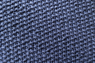 Hand knitting background. Volumetric pattern