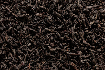 close up black tea leaves background