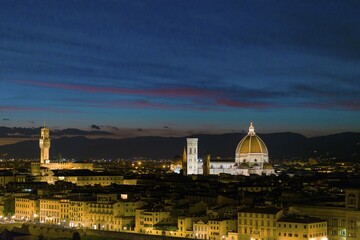 Panoramic view of illuminated city at dusk from Michelangelo Square, Piazzale Michelangelo, with...
