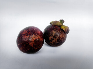 The fruit of Mangosteen or Garcinia mangostana or purple is sweet and sour, juicy, somewhat fibrous, with vesicles filled with liquid (like the flesh of citrus fruits).
