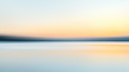 Obraz premium A blurred abstract background with a mix of warm and cool tones, softly transitioning between colors to create a tranquil and artistic effect.