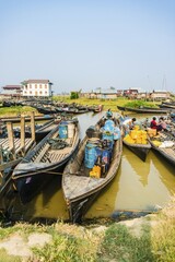 Wooden boats with old oil barrels in the harbor, Nampan, Inle Lake, Shan State, Myanmar, Asia