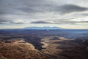 View from Grand View Point Overlook to erosion landscape, rock formations, Monument Basin, White Rim, back mountain range La Sal Mountains, La Sal Range, Island in the Sky, Canyonlands National Park, Utah, USA, North America