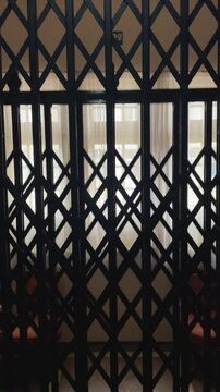 Interior of an old vintage open elevator in motion