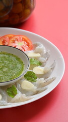 shrimp in fish sauce with Thai spicy seafood dipping sauce on white plate and umeshu