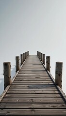 Obraz premium Wooden pier extending to a hazy horizon