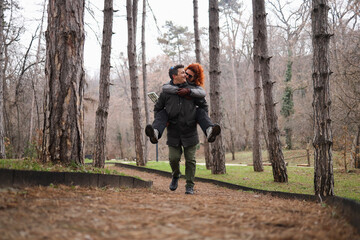 Obraz premium Adult man carrying his partner on his back