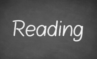 Obraz premium Reading lesson on blackboard or chalkboard. written in white chalk