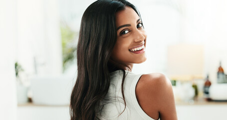 Bathroom, portrait and woman with smile for hair care, growth cosmetics and soft texture with beauty. Home, female person and satisfied with treatment for hairstyle, smooth and keratin in apartment