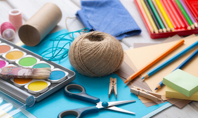 Craft materials for creative design with paper, cord and vibrant colors