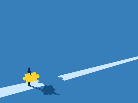 Solve the crisis, Businessman puts the missing pieces of the puzzle on the road