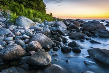 Stony beach with coastal forest at sunset, Baltic Sea, Jasmund National Park, Jasmund peninsula, Rügen Island, Mecklenburg Vorpommern, Germany, Europe