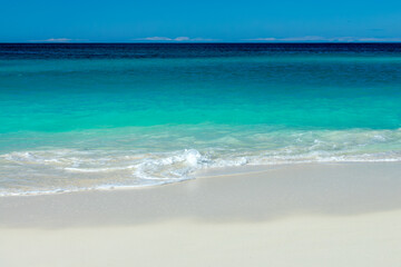 Front view of blue transparent water and perfect white sand in Shoal Bay beach, Caribbean dream...