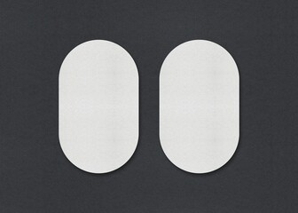 Two white oval sheets side by side on a gray background, Blank white Business card mockup stacks at grey textured paper background